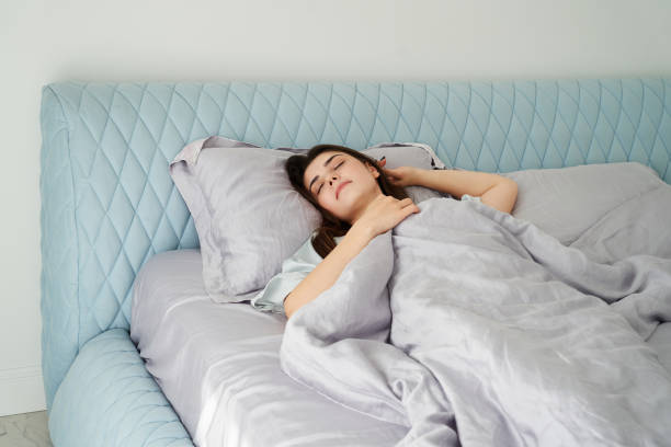 istock Beautiful woman sleeping in comfort bed. Rest, bed linen 1400141793