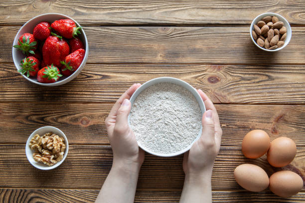 Ingredients for fruit strawberry cake or pie on rustic wooden table.