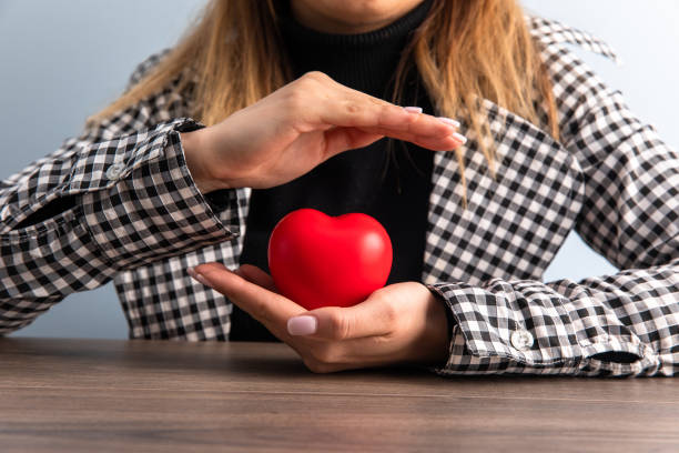 istock woman holding red heart 1400145864