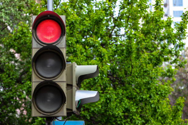 istock The red traffic light on the street 1400145877