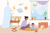 istock Happy mother and baby kid play fun game in home nursery, woman and boy sitting on floor 1400145941