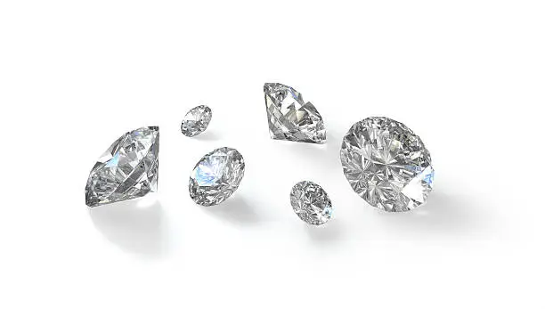 Few round cut diamonds isolated on white background