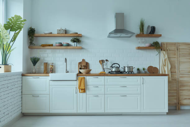 istock Cozy modern interior of kitchen interior with white furniture and bright elements 1400149852