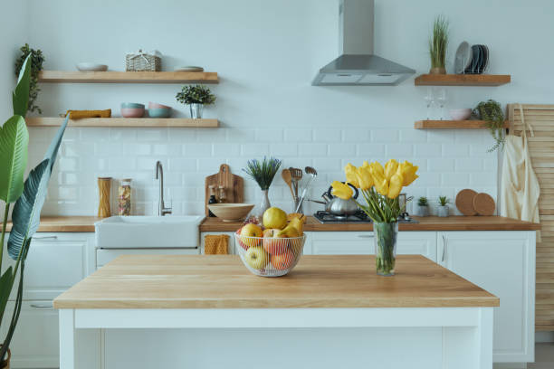 istock Cozy modern interior of kitchen interior with white furniture and bright elements 1400149855
