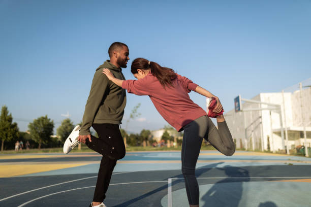 istock Two friends are stretching together 1400152697
