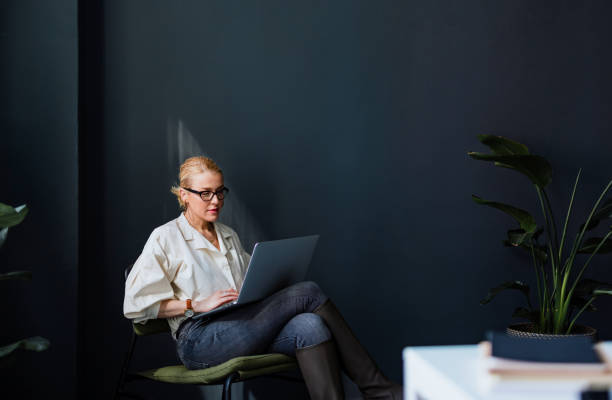 istock Serious Business Woman Using Laptop Computer In The Office 1400152735