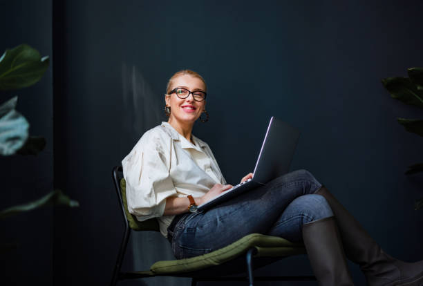 istock Happy Business Woman Using Laptop Computer In The Office 1400152737