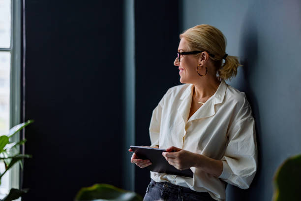 Happy Business Woman Working On A Digital Tablet