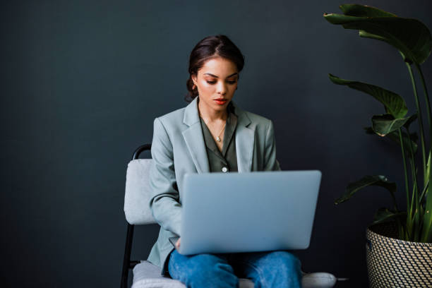 istock Serious Business Woman Using Laptop Computer In The Office 1400152772