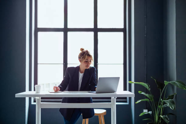istock Serious Business Woman Working In The Modern Office 1400152829