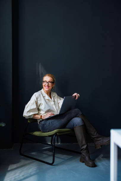 istock Happy Business Woman Using Laptop Computer In The Office 1400152891