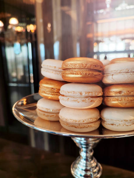 istock Stacked colorful macarons with silver plate. 1400152896