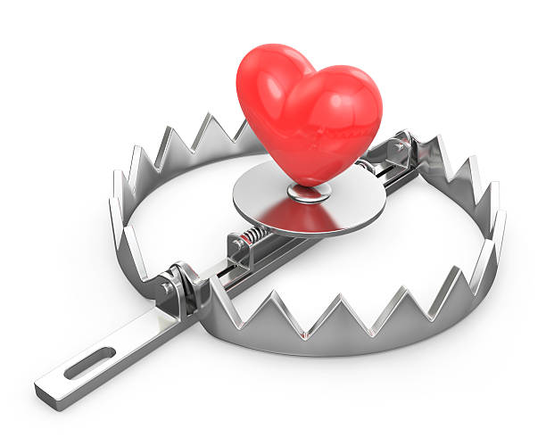 istock Red heart in a bear trap 140015479