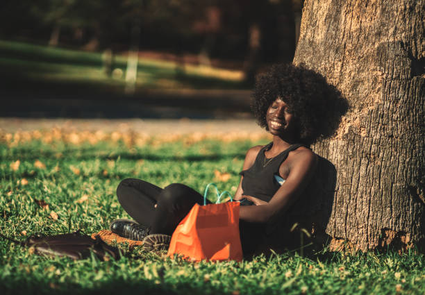 Cheerful black girl on the lawn