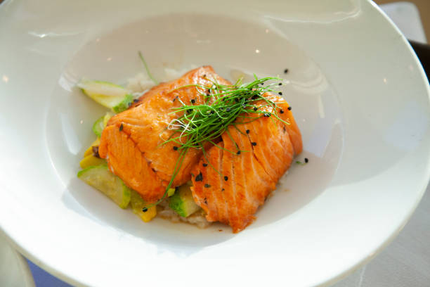 Grilled Salmon on a bed of vegtables and rice stock photo