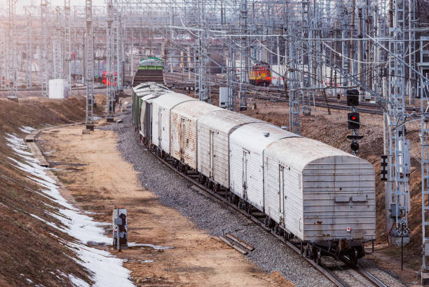 istock Long freight train approaches to the station. 1400158180