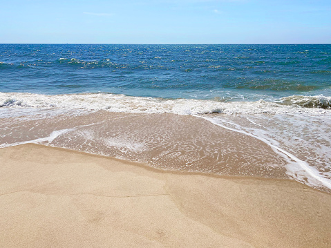 Beach With Golden Sand With Abstract Bokeh And Defocused Sea In Background