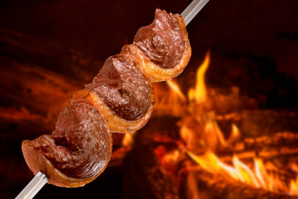 Picanha barbecue roasted on the spit on the coals. This type of barbecue is widely consumed throughout Brazil stock photo