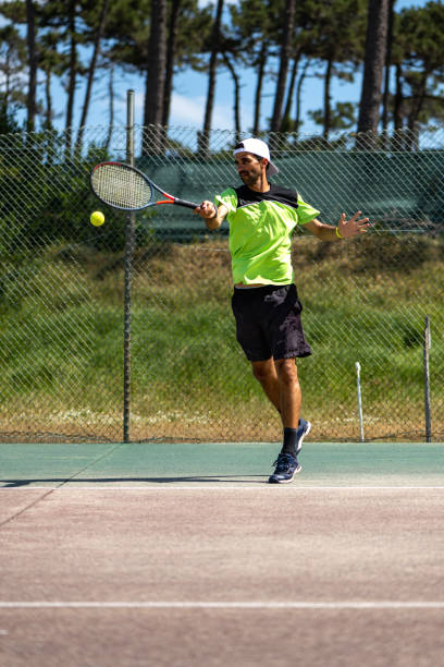 istock Tennis player hitting forehand at ball 1400163567