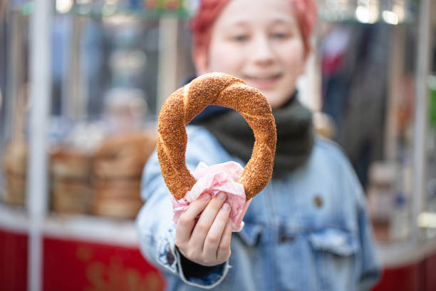 istock Boy holding traditional Turkish Bagel 1400163942