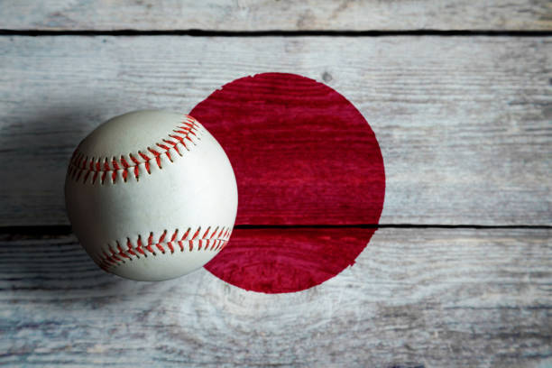 Leather Baseball on Rustic Wooden Background Painted With Japanese Flag stock photo