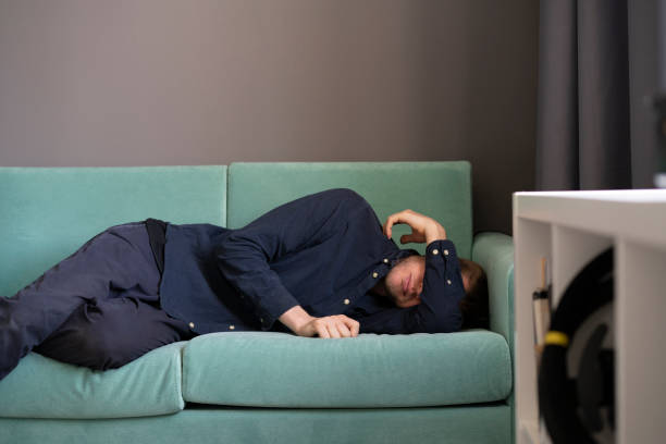 istock young guy lying and sleeping on the sofa at home in the afternoon 1400168050