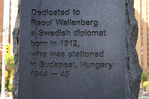 Monument honoring the Swedish diplomat Raoul Wallenberg, at United Nations Plaza, by Gustav Kraitz in collaboration with Ulla Kraitz, dedicated in 1998, detail, dedication inscription carved in stone, New York, NY, USA