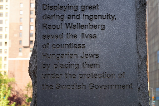 Monument honoring the Swedish diplomat Raoul Wallenberg, at United Nations Plaza, by Gustav Kraitz in collaboration with Ulla Kraitz, dedicated in 1998, detail, dedication inscription carved in stone, New York, NY, USA