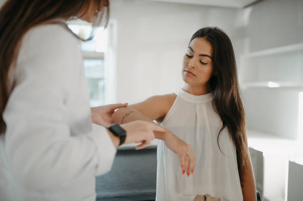istock physical therapist examining woman's arm 1400184207
