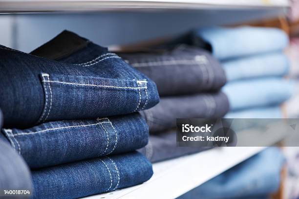 Jeans Clothes On Shelf In Shop Stock Photo - Download Image Now - Jeans, Store, Clothing