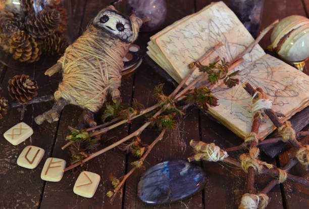 istock Wicca, esoteric and occult still life with vintage magic objects and voodoo doll on witch table altar for mystic rituals and fortune telling. Halloween and gothic concept 1400187848