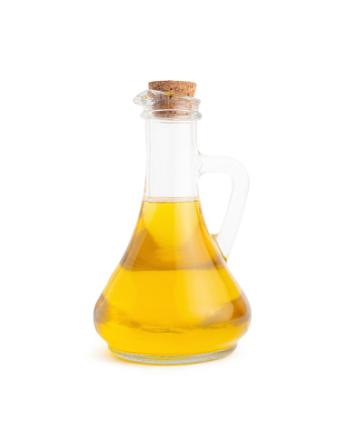 oil in a glass flask on a white isolated background