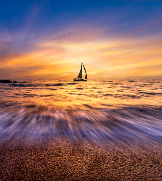 istock Inspirational t Sailboat Sunset Ocean Landscape Vertical 1400188882