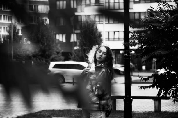 young attractive woman posing on autumn street, monochrome