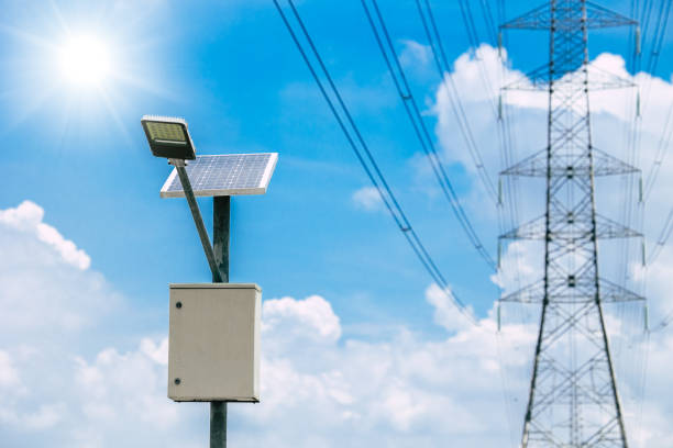 istock solar panel lamp with high voltage electricity tower on blue sky background for sustainable energy 1400201394