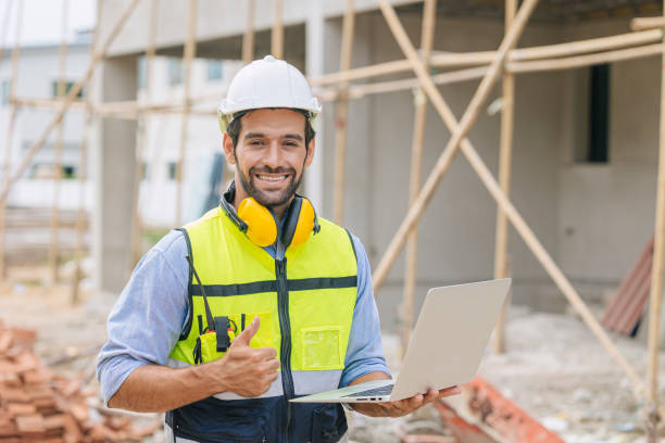 istock caucasian latin worker foreman home builder hand sign thumbs up for good pass build and safety quality confirm concept. 1400201437