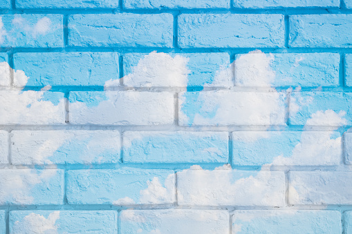 beautiful blue sky overlay with brick wall for postcard background