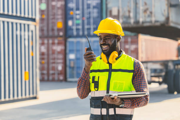 istock black worker African working engineer foreman radio control in port cargo shipping customs container yard 1400201512