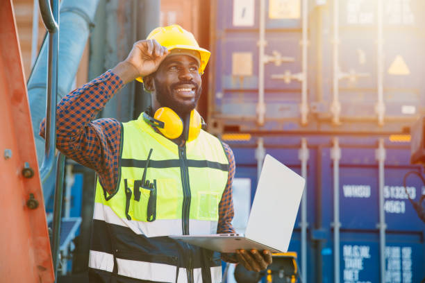 istock black worker African working engineer foreman in port cargo shipping with computer laptop 1400201532