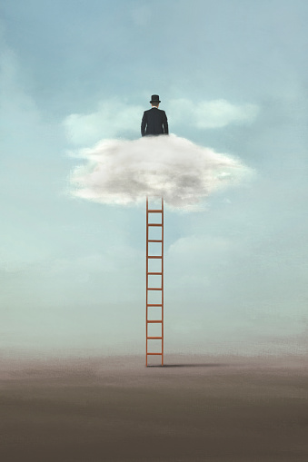 businessman on a ladder dreams of the future in the clouds