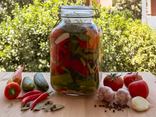 istock Jar of pickles on garden table 1400207349