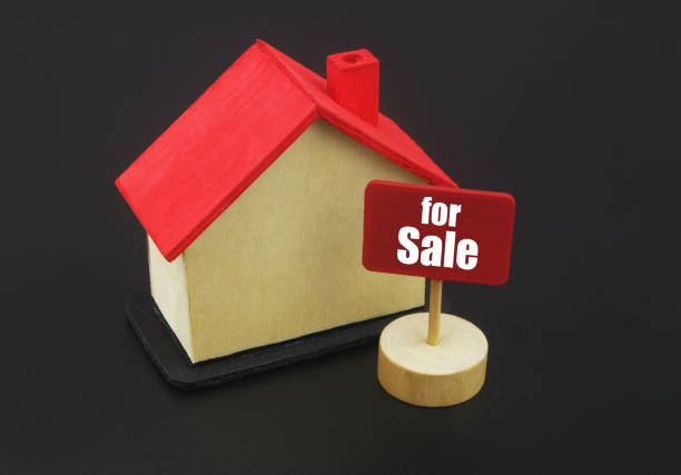 istock House model with banner for sale on black background 1400208764