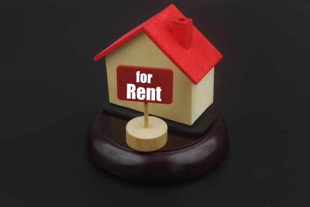 istock House model with banner for rent on black background 1400208770