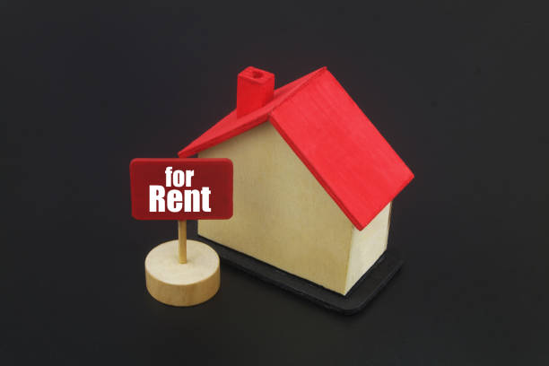 istock House model with banner for rent on black background 1400208791