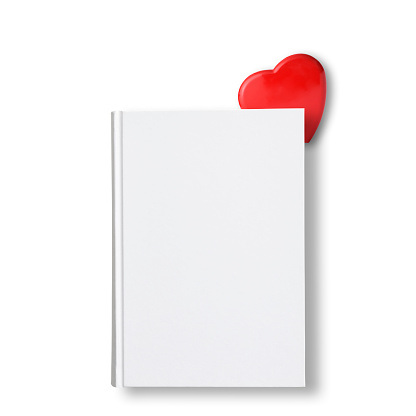 Overhead shot of closed blank book with red heart on white background.