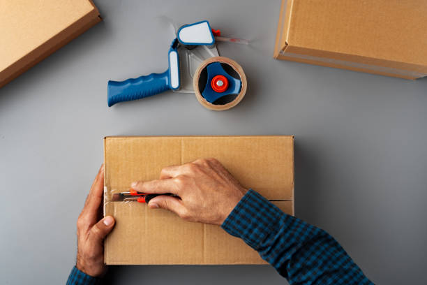 istock Above table top view of warehouse preparing post courier delivery package box 1400209806
