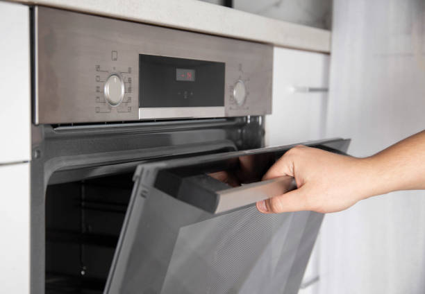 istock Black modern electric oven in white kitchen with thermo grill and convection function. 3d hot air and vario-grill, large 1400211479