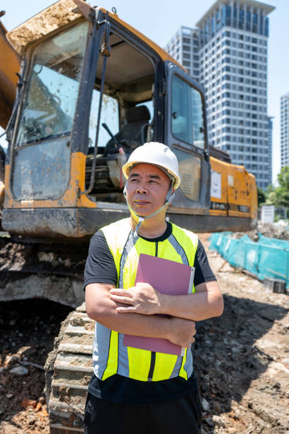 istock Asian male architect at construction site 1400211784