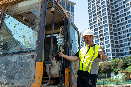 Confident male construction machine driver