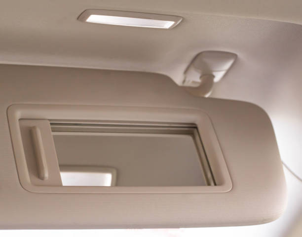 istock Modern car sun visor with mirror, close-up. Sunshield 1400212013